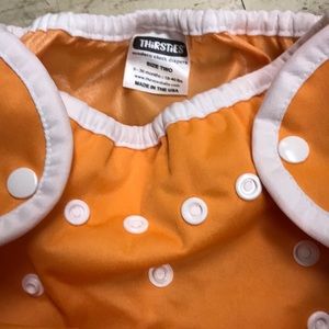SOLD - Two Used baby adjustable diaper covers